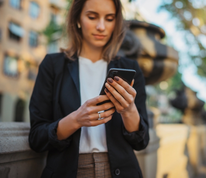 Person using a phone outdoors