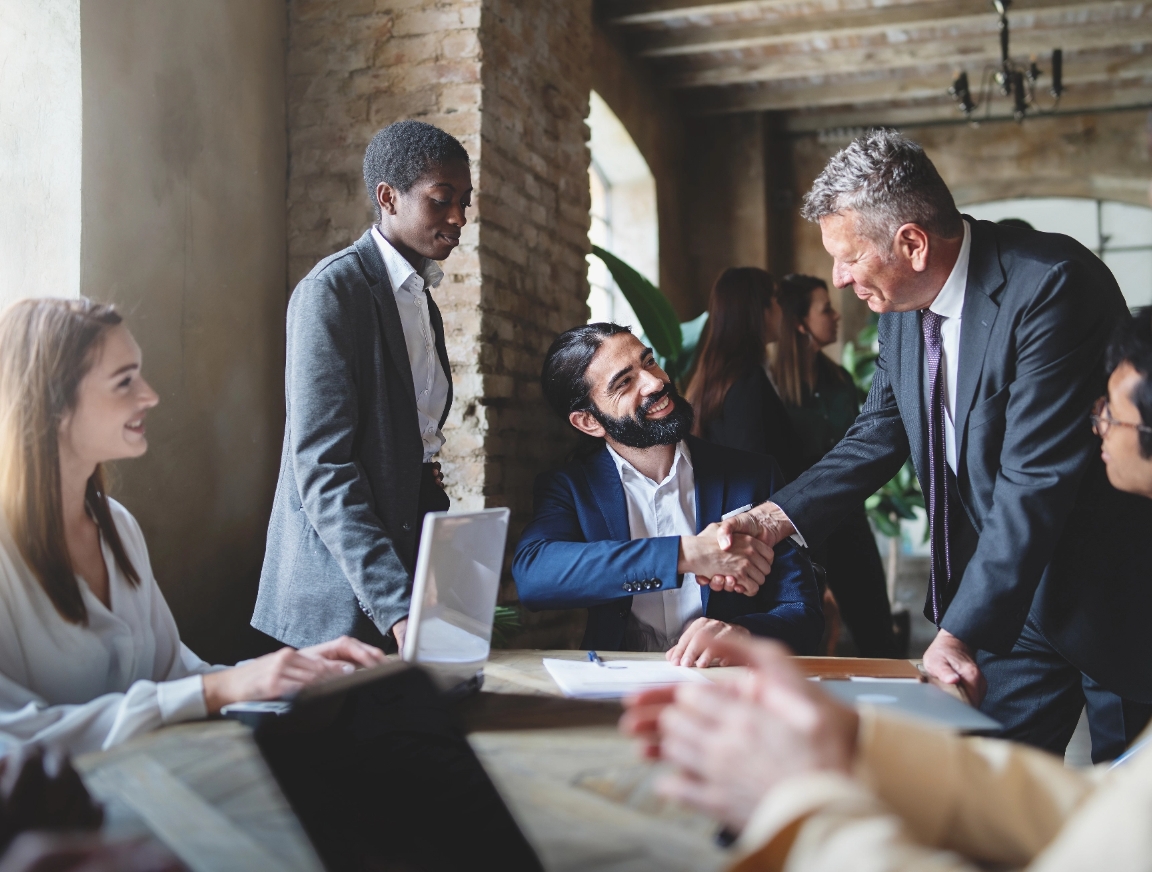 Partners meeting around a conference table